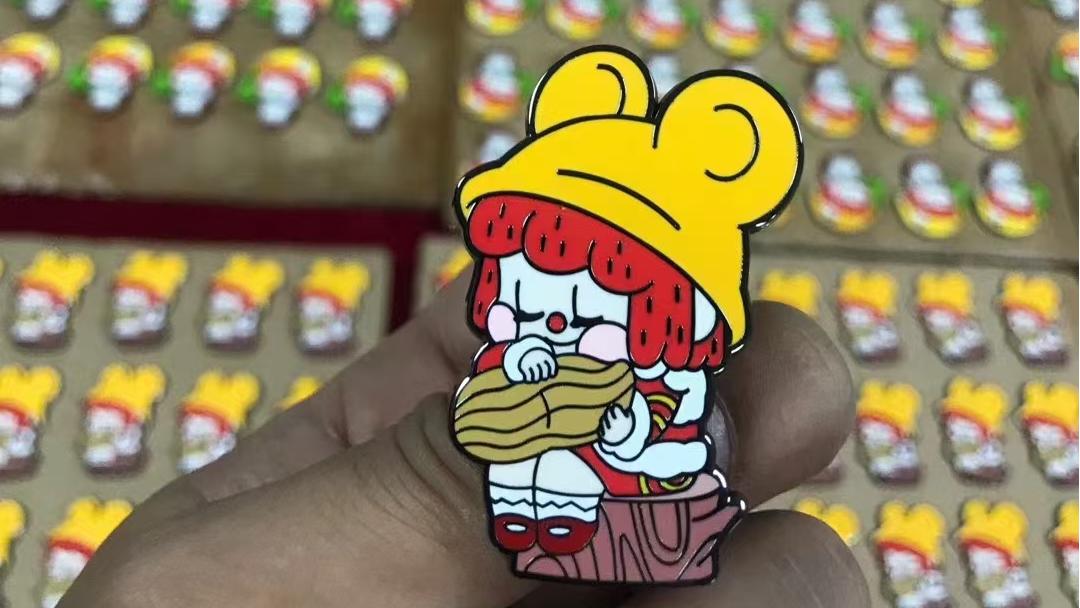 A Deep Dive into the Enamel Pin Types Offered by Enamel Pin Custom